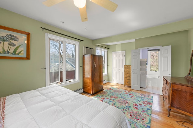 17864 Gladville Ave, Homewood, IL 60430 - bedroom featuring a baseboard heating unit, ensuite bath, light wood finished floors, and ceiling fan