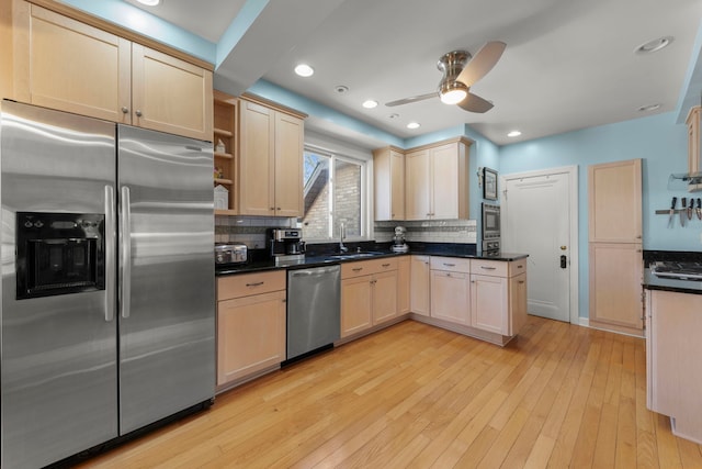 17864 Gladville Ave, Homewood, IL 60430 - kitchen with a ceiling fan, a sink, light wood-type flooring, stainless steel appliances, and backsplash