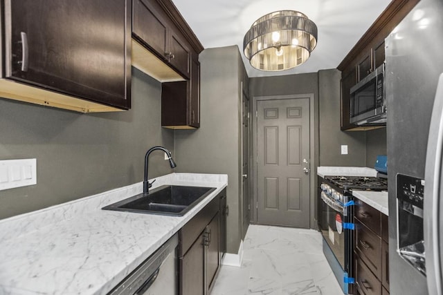 230 Dodge Ave Unit D, Evanston, IL 60202 - kitchen featuring stainless steel appliances, baseboards, marble finish floor, a sink, and dark brown cabinets