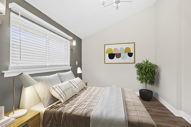 230 Dodge Ave Unit D, Evanston, IL 60202 - bedroom with baseboards, vaulted ceiling, and wood finished floors