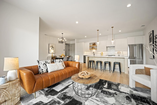 1548 W Ardmore Ave Unit 2F, Chicago, IL 60660 - living room featuring a chandelier, light wood-style flooring, and recessed lighting