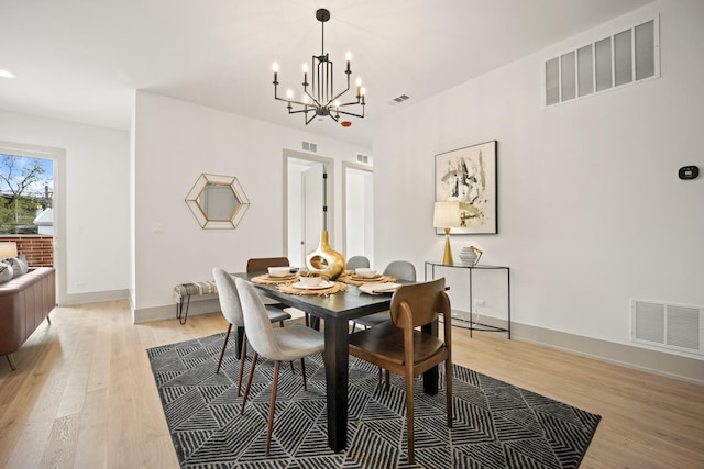1548 W Ardmore Ave Unit 2F, Chicago, IL 60660 - dining room with a chandelier and light wood finished floors