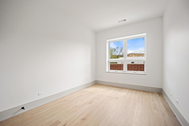 1548 W Ardmore Ave Unit 2F, Chicago, IL 60660 - spare room with light wood-type flooring and baseboards