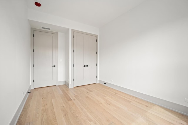 1548 W Ardmore Ave Unit 2F, Chicago, IL 60660 - unfurnished bedroom featuring light wood-type flooring and baseboards