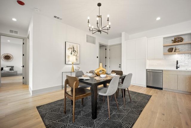 1548 W Ardmore Ave Unit 2F, Chicago, IL 60660 - dining space featuring light wood-style floors, a chandelier, and recessed lighting