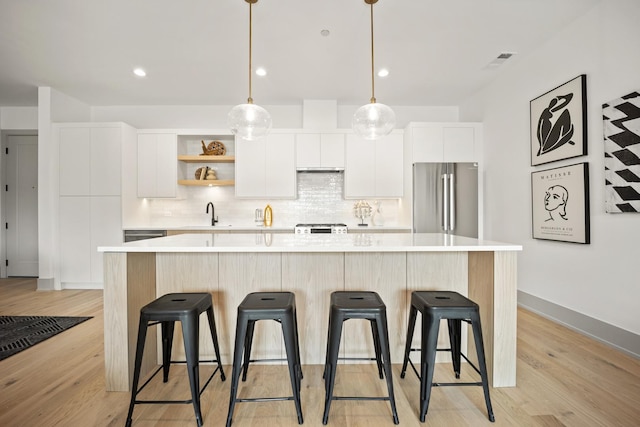1548 W Ardmore Ave Unit 2F, Chicago, IL 60660 - kitchen with freestanding refrigerator, white cabinets, light countertops, backsplash, and recessed lighting