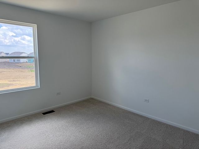 640 Henry Ln, Oswego, IL 60543 - spare room featuring carpet flooring and baseboards