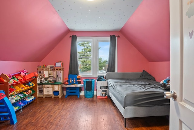 bedroom featuring wood-type flooring and vaulted ceiling