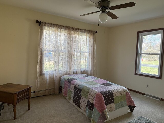 bathroom featuring a shower with curtain, visible vents, baseboard heating, toilet, and vanity