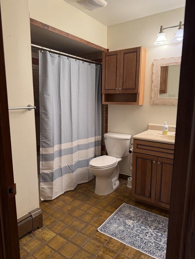 bathroom with toilet and vanity