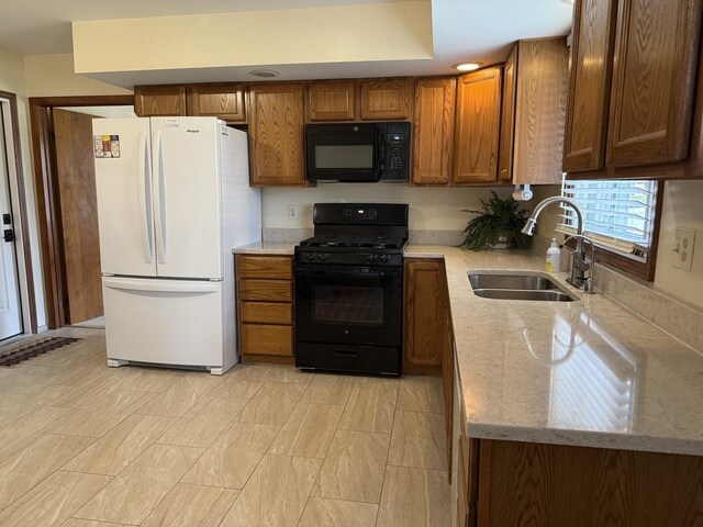 kitchen with a sink, white dishwasher, brown cabinets, and light countertops