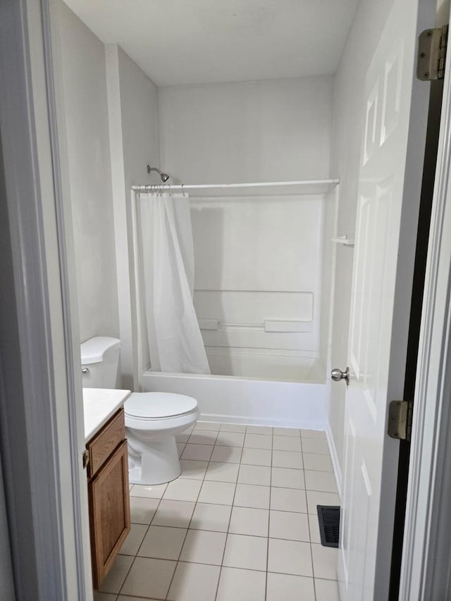 bathroom featuring tile patterned flooring, vanity, visible vents, and toilet