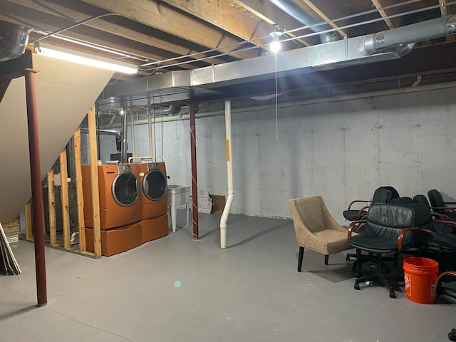 unfinished basement with separate washer and dryer