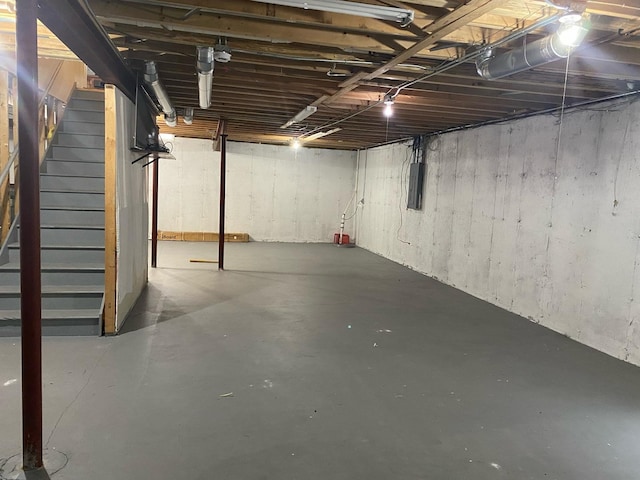 unfinished below grade area with washing machine and clothes dryer