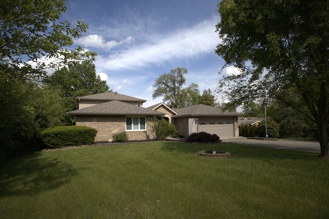 19049 S Parker Rd, Mokena, IL 60448 - view of front of home with an attached garage, a front lawn, driveway, brick siding, and roof with shingles