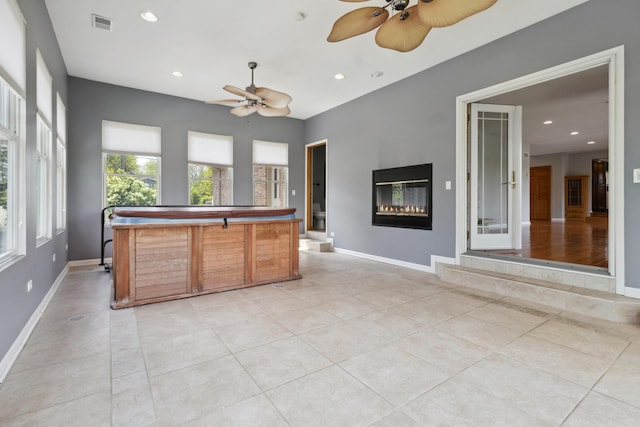 19049 S Parker Rd, Mokena, IL 60448 - kitchen with a ceiling fan, light tile patterned flooring, a glass covered fireplace, recessed lighting, and a kitchen island