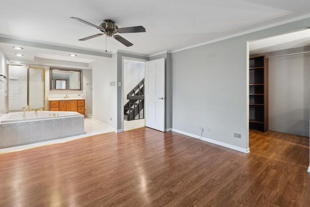 19049 S Parker Rd, Mokena, IL 60448 - unfurnished bedroom with recessed lighting, ensuite bath, light wood-style flooring, a walk in closet, and ceiling fan