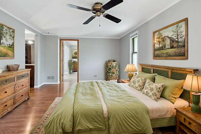 19049 S Parker Rd, Mokena, IL 60448 - bedroom with wood finished floors, ornamental molding, ceiling fan, and connected bathroom