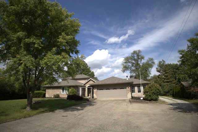 19049 S Parker Rd, Mokena, IL 60448 - ranch-style house with asphalt driveway, an attached garage, and a front yard