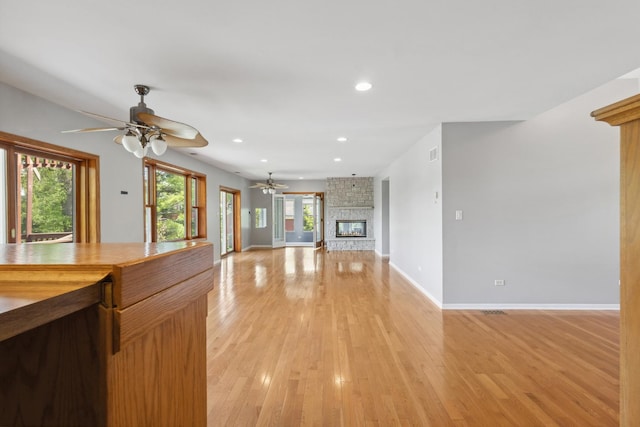 19049 S Parker Rd, Mokena, IL 60448 - unfurnished living room featuring ceiling fan, a fireplace, light wood-style floors, and recessed lighting