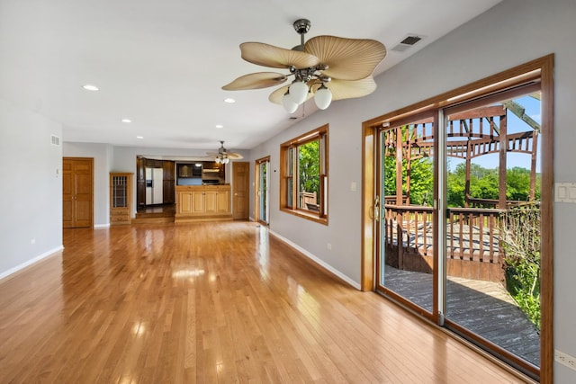 19049 S Parker Rd, Mokena, IL 60448 - unfurnished living room featuring plenty of natural light, light wood finished floors, a ceiling fan, and recessed lighting
