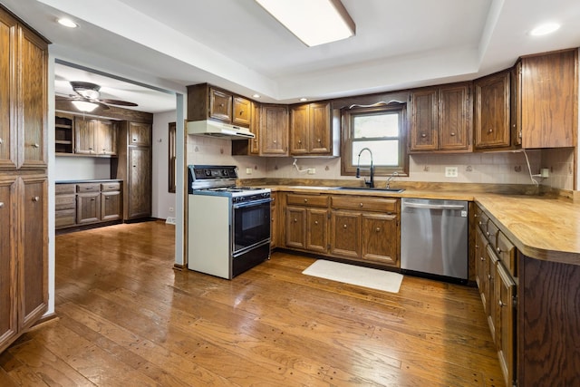 19049 S Parker Rd, Mokena, IL 60448 - kitchen with dishwasher, gas stove, under cabinet range hood, hardwood / wood-style flooring, and recessed lighting