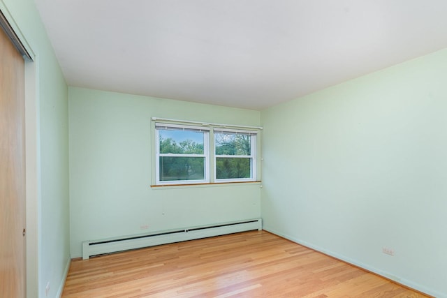 129 Roth Ave, Barrington, IL 60010 - unfurnished room featuring baseboard heating and wood finished floors