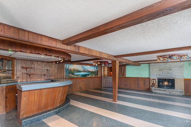129 Roth Ave, Barrington, IL 60010 - indoor bar with wooden walls, a textured ceiling, wainscoting, a fireplace, and beamed ceiling
