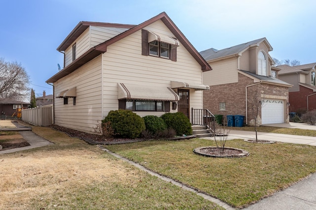 traditional-style home featuring concrete driveway and a front yard