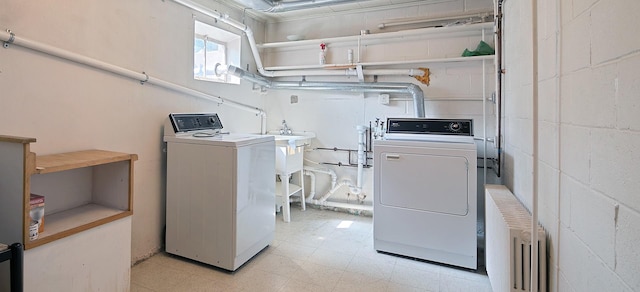 12332 S Harold Ave, Palos Heights, IL 60463 - clothes washing area with radiator heating unit, separate washer and dryer, concrete block wall, and light floors