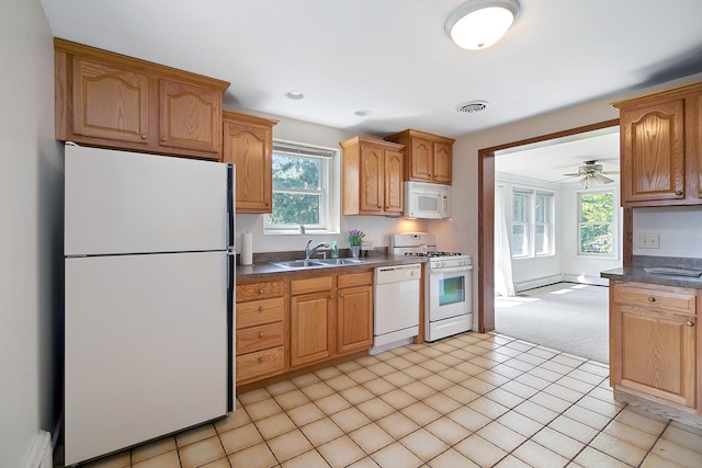 12332 S Harold Ave, Palos Heights, IL 60463 - kitchen with white appliances, visible vents, a baseboard heating unit, a sink, and dark countertops