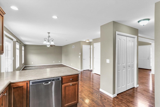 kitchen featuring dishwasher, dark wood-type flooring, open floor plan, baseboards, and decorative light fixtures