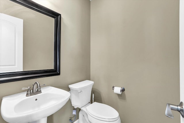 bathroom featuring a sink and toilet