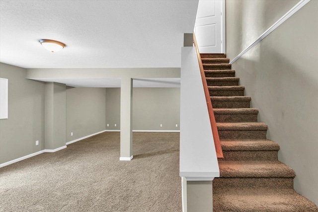 stairs with carpet floors and baseboards