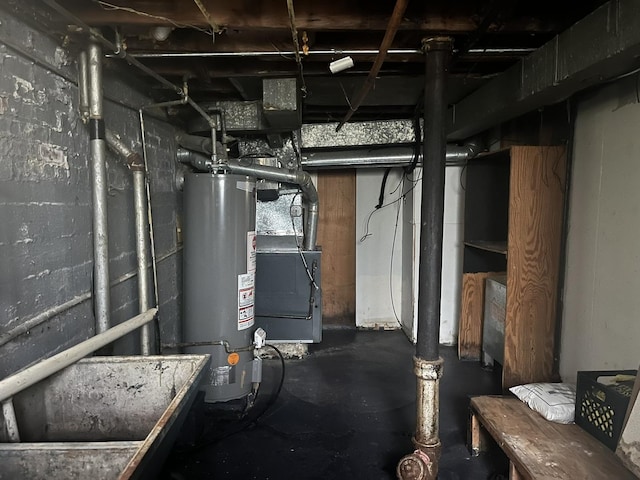 below grade area featuring heating unit and gas water heater