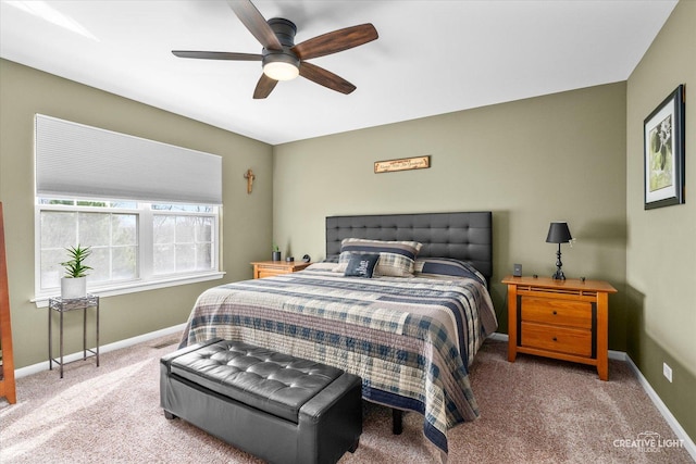 bedroom with baseboards, ceiling fan, and carpet