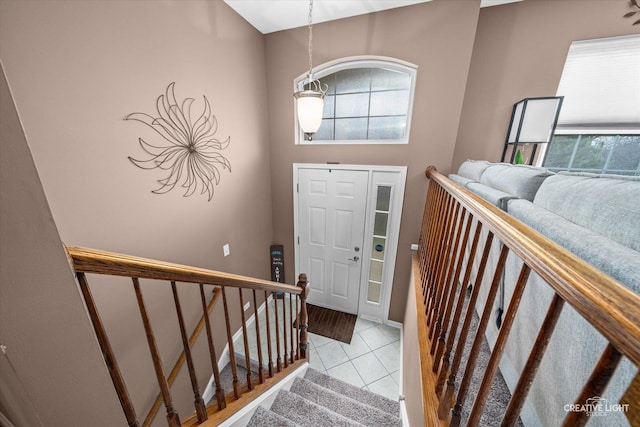 tiled entryway with stairway