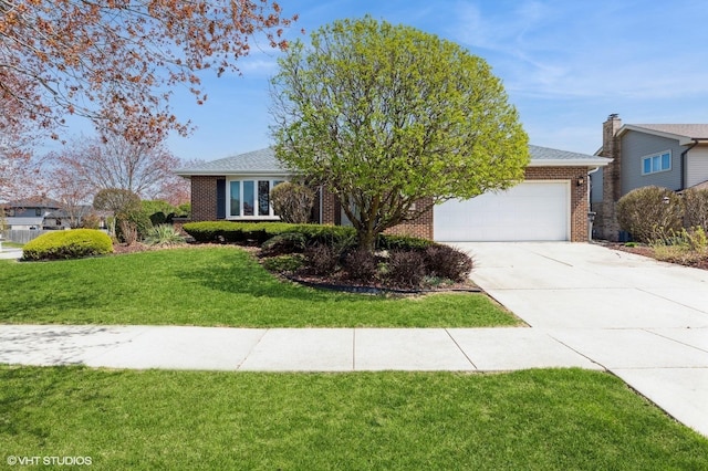 view of front of property with brick siding, an attached garage, driveway, and a front yard