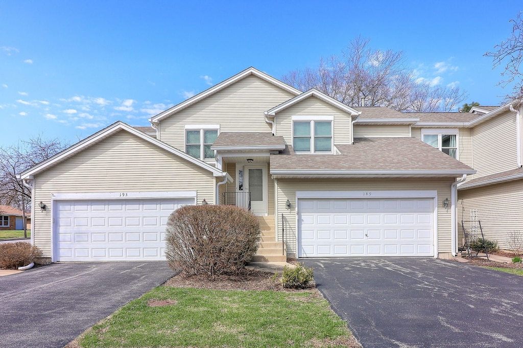 189 Lilac Ln Unit 189, North Aurora, IL 60542 - view of front of home with a garage, aphalt driveway, and roof with shingles