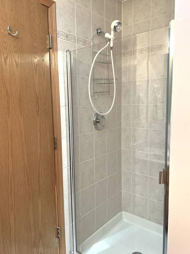 bathroom with a shower stall