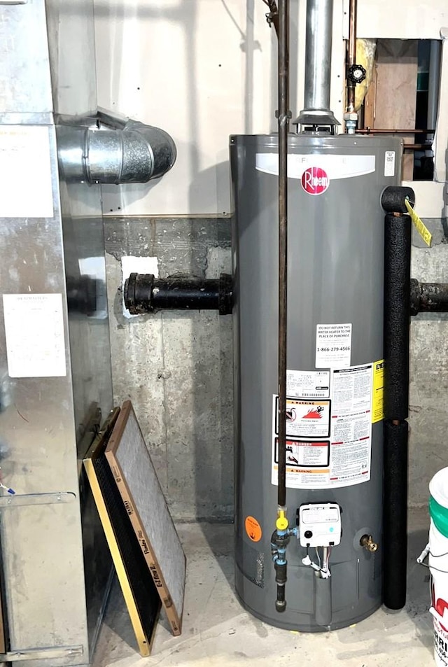 utility room featuring water heater