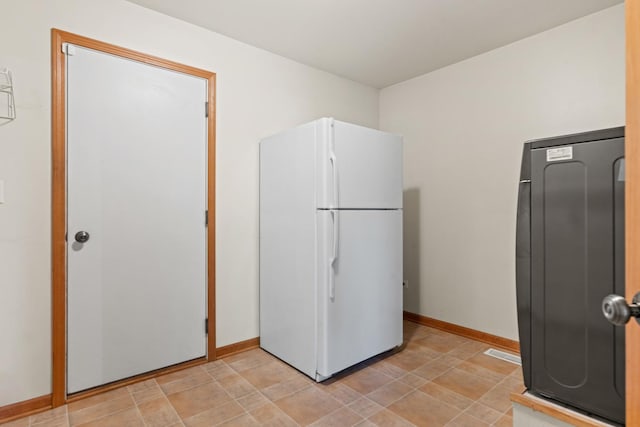 968 Pattee Ave, Elburn, IL 60119 - kitchen with freestanding refrigerator and baseboards