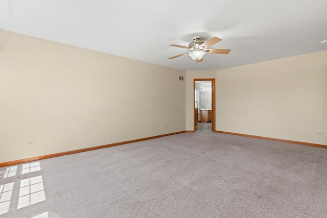 968 Pattee Ave, Elburn, IL 60119 - spare room featuring ceiling fan, baseboards, and light colored carpet