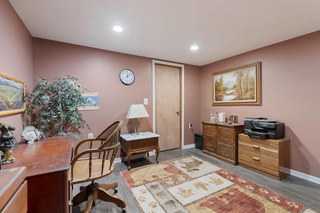office space featuring recessed lighting, wood finished floors, and baseboards