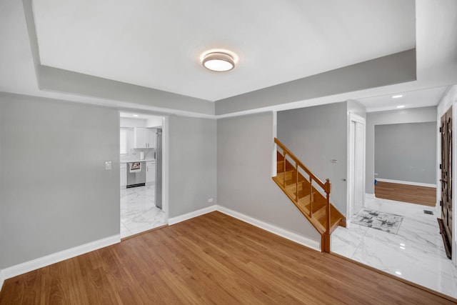127 Tottenham Ln, Elk Grove Village, IL 60007 - unfurnished room featuring recessed lighting, marble finish floor, stairs, and baseboards