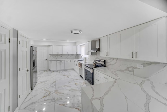127 Tottenham Ln, Elk Grove Village, IL 60007 - kitchen with white cabinets, a sink, stainless steel appliances, light stone countertops, and wall chimney exhaust hood