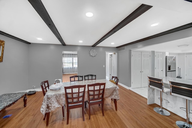 127 Tottenham Ln, Elk Grove Village, IL 60007 - dining room featuring visible vents, light wood-type flooring, beamed ceiling, and baseboards