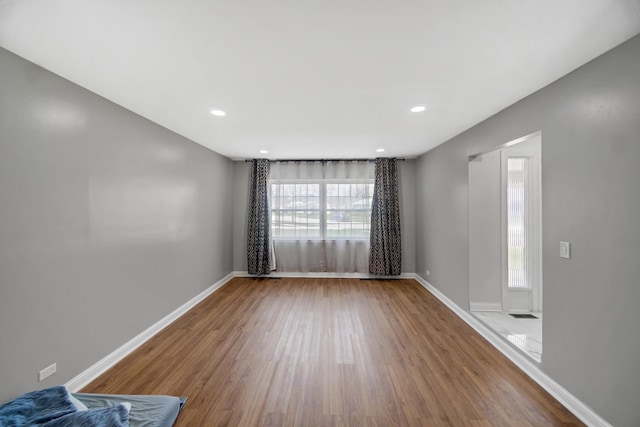 127 Tottenham Ln, Elk Grove Village, IL 60007 - unfurnished room with baseboards, recessed lighting, and wood finished floors