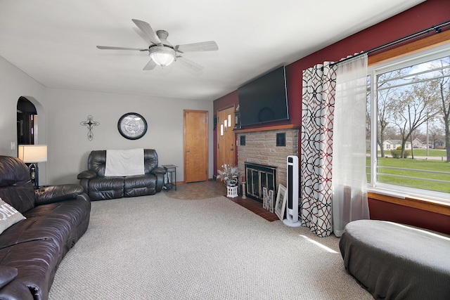 493 W Chebanse Ave, Chebanse, IL 60922 - living area with arched walkways, ceiling fan, a wealth of natural light, and carpet