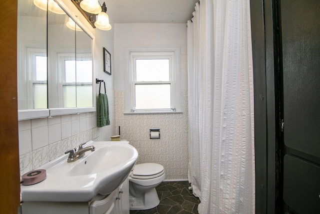 493 W Chebanse Ave, Chebanse, IL 60922 - bathroom with vanity, tile walls, toilet, tile patterned flooring, and a shower with shower curtain